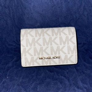 Micheal Kors Wallet Cream colored exterior with light brown interior.
